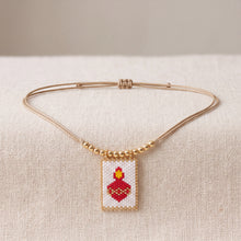 Load image into Gallery viewer, Choker con escapulario Miyuki del Sagrado Corazón, balines dorados y cordón beige ajustable