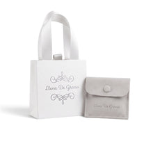 Load image into Gallery viewer, Llena de Gracia white gift bag and grey suede pouch for religious jewelry packaging on a white background