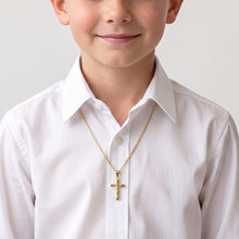 Load image into Gallery viewer, Cadena con dije de Cristo Llena de Gracia en oro 18k, ideal para primera comunión sobre camisa blanca de niño.
