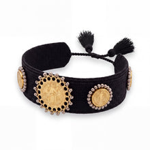 Cargar imagen en el visor de la galería, Pulsera Llena de Gracia tejida en hilo negro con tres dijes de San Benito en baño de oro de 18k y borlas decorativas
